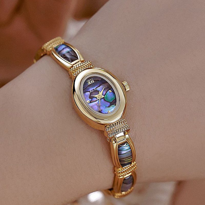 Luxury Watch Unique - นาฬิกาข้อมือผู้หญิง หน้าปัดรูปไข่ แบรนด์ดัง หรูหรา ดีไซน์โดดเด่น สีทอง